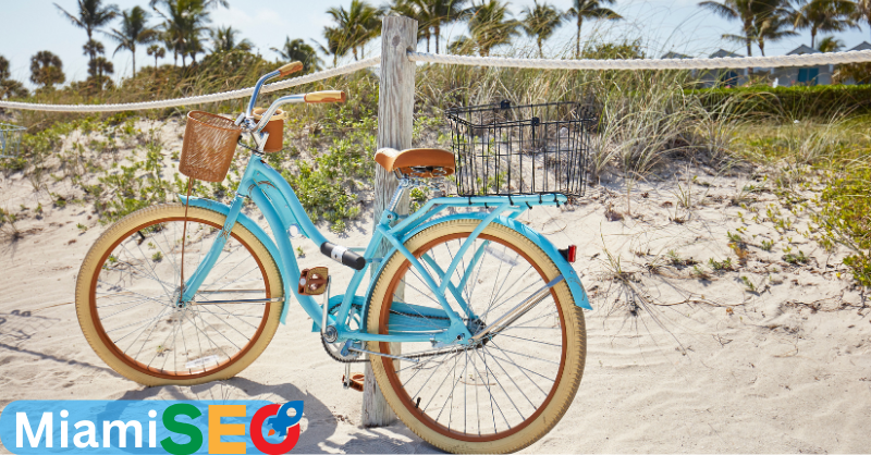 SEO company in miami, letters in a bike on the sand